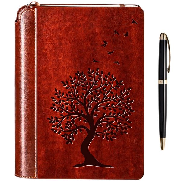A brown vegan leather journal with a tree of life embossed on the cover and a pen holder on the spine, accompanied by a black lacquered metal pen with gold trim.