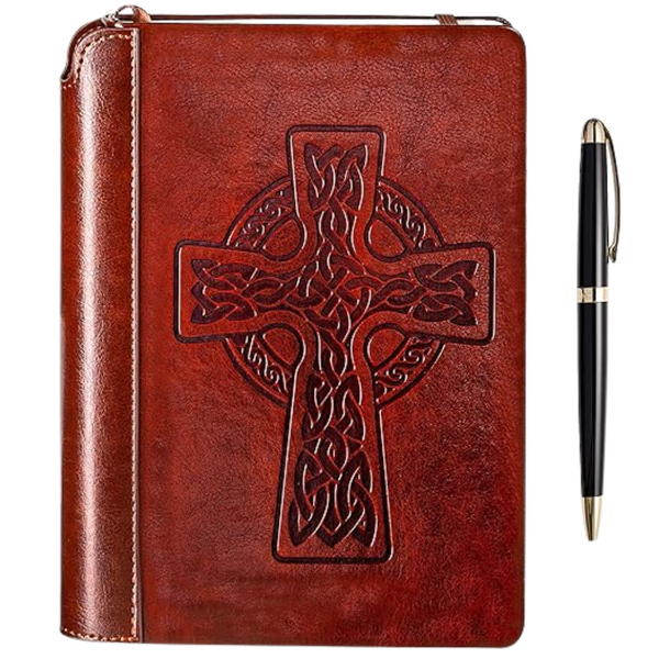A brown vegan leather journal with a Celtic cross embossed on the cover and a black lacquered metal pen with gold trim.