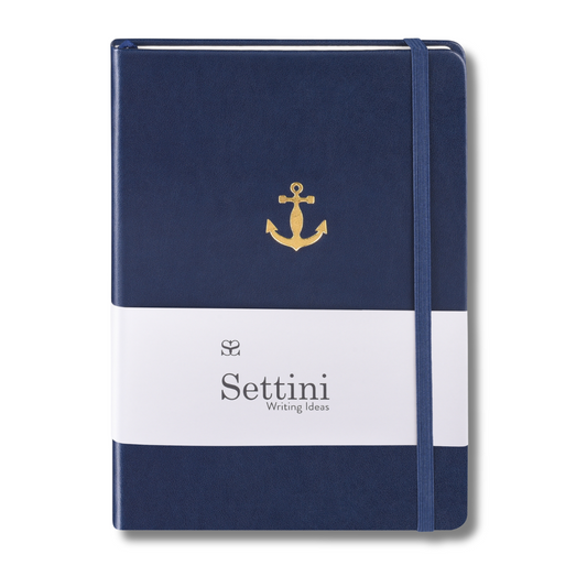 A navy-colored hardcover journal with a gold anchor design on the cover, titled 'SETTINI' on the front, and a white band with text on the spine.
