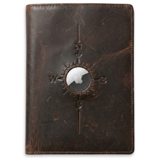 Brown leather notebook with compass design on a white background