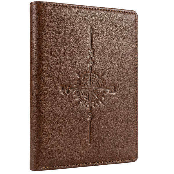 Brown leather passport holder with embossed compass design on a white background